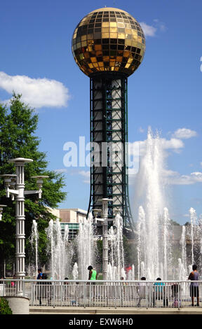 Visitors enjoy the water fountains of World's Fair Park in downtown Knoxville, Tennessee. The Sunsphere is in the background. Stock Photo