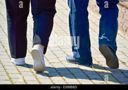 Middle aged couple in a relaxing walk on the pavement Stock Photo