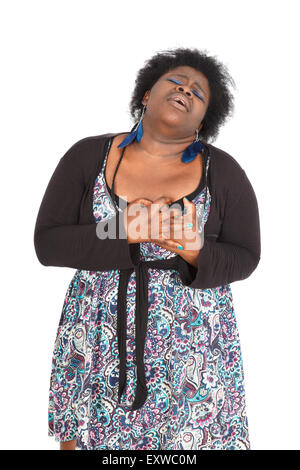 Beautiful black woman doing different expressions in different sets of clothes: heart attack Stock Photo