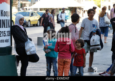 Athens, GREECE. 17th July, 2015. Migrants are arriving at the port of Piraeus, Greece, on a nearly daily basis. On Thursday morning, another 200 Syrian migrants and refugees traveled from Greek islands' detention centers to Piraeus and later moved to Omonoia Square in downtown Athens. Most of them are forced to sleep on the hard floor, while many mothers are struggling to find food for their children. Credit:  ZUMA Press, Inc./Alamy Live News Stock Photo