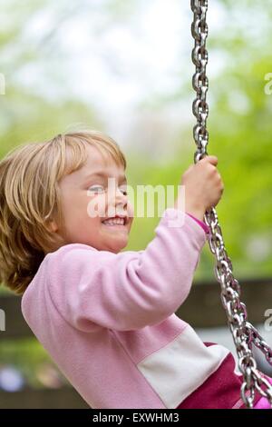 the portrait of girl on the swings Stock Photo - Alamy