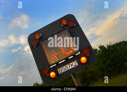 flashing warning sign of 40mph reduced speed limit on M1 motorway due to roadworks near Leeds Yorkshire UK Stock Photo