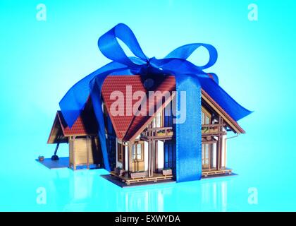 Model house as present with bow Stock Photo