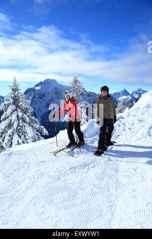 Female skier and snowboarder, Tegelberg, Ammergau Alps, Allgaeu, Bavaria, Germany, Europe Stock Photo
