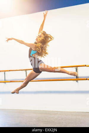 Young woman dancing in dance studio Stock Photo