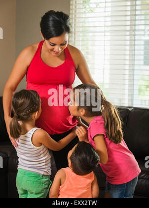 Pregnant mother and children (2-3, 6-7, 8-9) Stock Photo