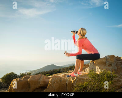 Woman in sportswear drinking water Stock Photo