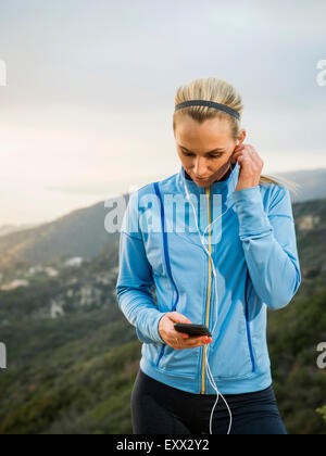 Woman checking smart phone Stock Photo