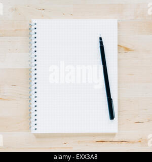 Overhead view of pen on notebook Stock Photo