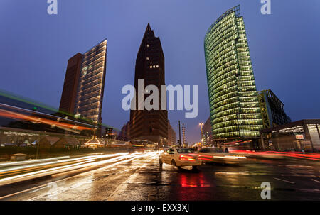 Illuminated skyscrapers and street traffic Stock Photo