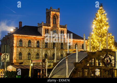 Illuminated Christmas tree and town hall Stock Photo