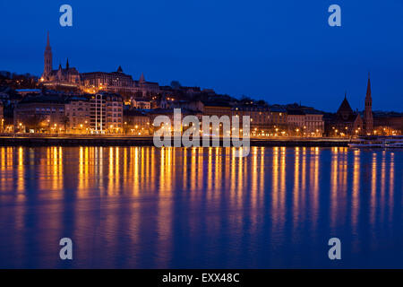 Illuminated skyline reflecting in Danube River