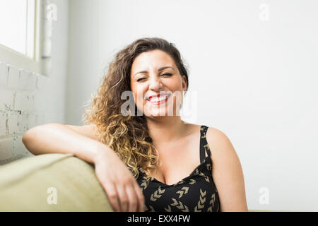 Woman laughing with closed eyes Stock Photo