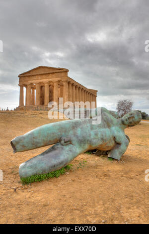 Icarus Bronze Man Statue in front of the Temple of Concordia, Valley of the Temples, Agrigento, Sicily, Italy Stock Photo