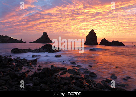 Cyclops stacks in Aci Trezza at sunrise, Sicily, Italy Stock Photo