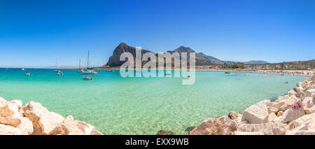 SAN VITO LO CAPO, ITALY - AUGUST 24, 2014: tourists and locals enjoy blue mediterranean sea in San Vito Lo Capo, Italy. Stock Photo