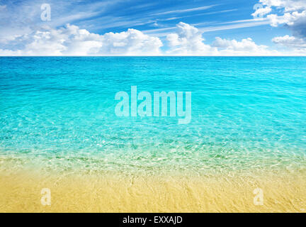 Summer beach background, clear water and blue cloudy sky. Stock Photo