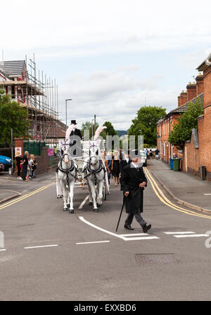 Tamworth Staffordshire UK. 17th July 2015.  Beautiful white horses transported the coffin of Sue Davey. A victim of the terrorist attack in Tunisia. Sue lived in Tamworth in the Midlands. Credit:  Chris Gibson/Alamy Live News Stock Photo