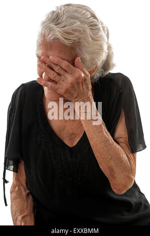 Very happy Senior smilling and covering her face. Stock Photo