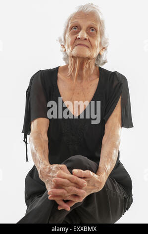 Senior smilling and looking at up . Stock Photo