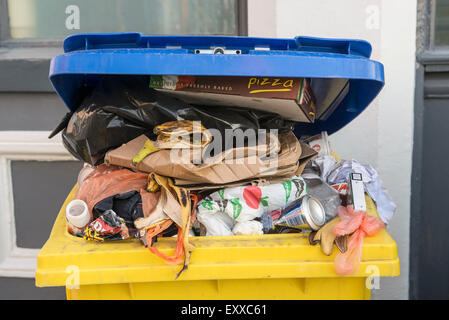 Wheelie bin full of trash / rubbish, Europe Stock Photo