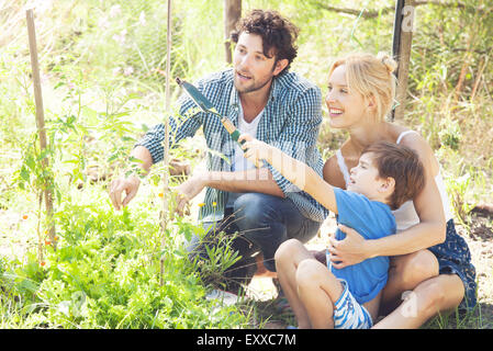 Little boy learning how to garden Stock Photo