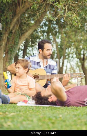 Man napping at picnic Stock Photo