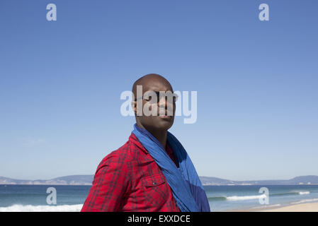 Man at the beach, looking away in thought, portrait Stock Photo