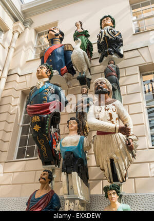 Historic ships' figureheads on display inside the National Maritime Museum, Greenwich, London, England, UK