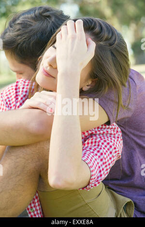 Couple embracing outdoors Stock Photo