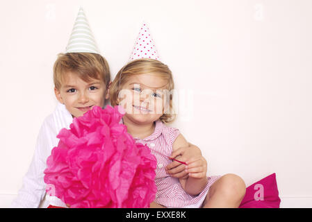 Brother and sister at birthday party, portrait Stock Photo