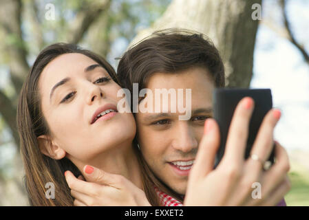 Couple posing for selfie outdoors Stock Photo