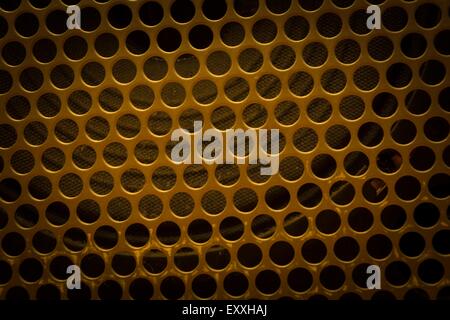 Texture of metal with holes - speaker fron side. Texture useful as background Stock Photo