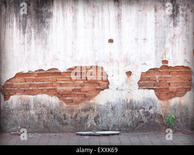 Decayed, cracked concrete vintage brick wall background. Stock Photo