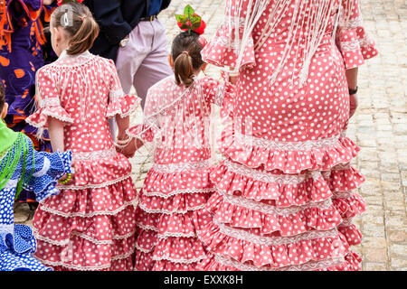 Young girls in traditional Seville dress in Seville, Andalucia, Spain ...