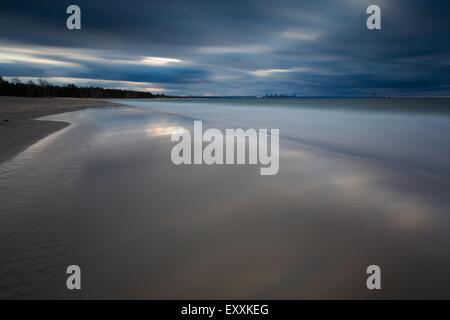 Baltic shore photographed on long exposure. Dark dramatic seascape of polish shore of Baltic sea. Stock Photo