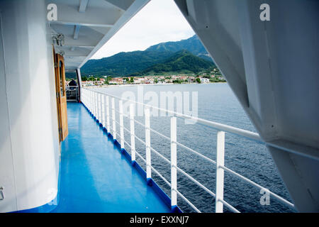 Blue turquoise floor with white fence on a ferry boat Stock Photo