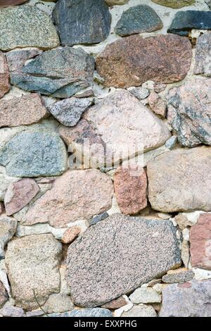 Beautiful close up of old stone wall - useful as background. Stock Photo