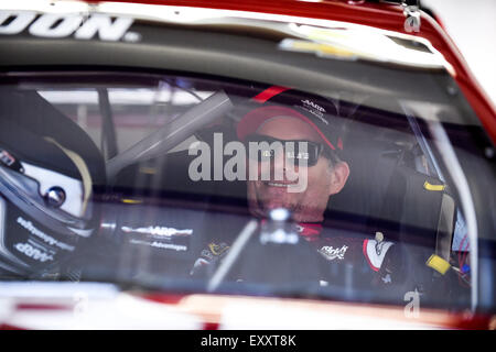 Loudon, New Hampshire, USA. 17th July, 2015. Sprint Cup Series driver Jeff Gordon (24) sits in his car prior to a practice session at the 5-hour Energy 301 NASCAR Sprint Cup series race at the New Hampshire Motor Speedway. Eric Canha/CSM/Alamy Live News Stock Photo