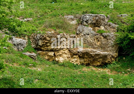 General view toward sedimentary  boulder in the field, Ludogorie, Bulgaria Stock Photo