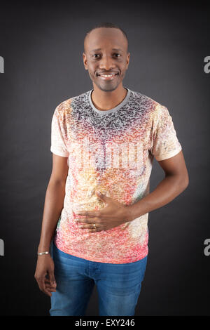 Handsome man doing different expressions in different sets of clothes: hungry Stock Photo