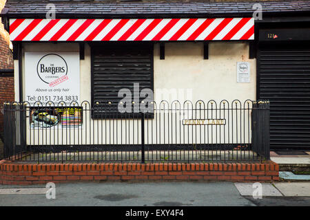 Liverpool, United Kingdom - October 12, 2014:   Landmark Penny Lane Barber Shop in Liverpool made famous by The Beatles in 1967. Stock Photo