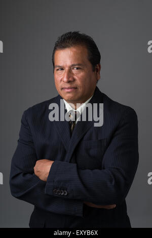 Businessman in business suit looking suspicious and upset. Stock Photo