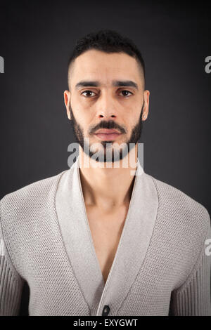 Handsome man doing different expressions in different sets of clothes: thinking Stock Photo