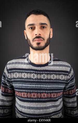 Handsome man doing different expressions in different sets of clothes: thinking Stock Photo