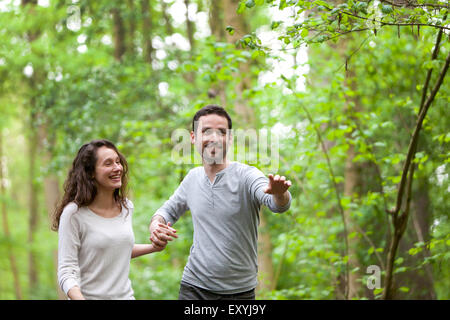 View of a Young couple having a walk in a forest Stock Photo