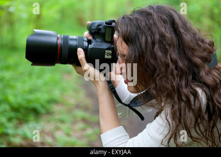 View of Photographer taking picture in the nature Stock Photo
