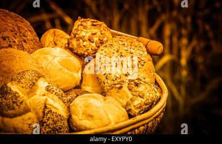 Assortment of golden loafs of bread and bread rolls Stock Photo