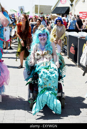 Brighton UK Saturday 18th July 2015 - Hundreds of people take part in the March of the Mermaids parade along Brighton seafront which raises money for the World Cetacean Alliance Stock Photo