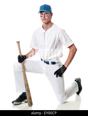 Young adult baseball player. Studio shot over white. Stock Photo